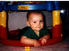 Blake hiding under his Rocker/Entertainer