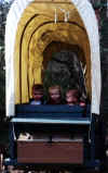 Blake and his buddies in a covered wagon